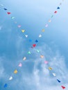 WormÃ¢â¬â¢s Eye View of Colourful Small Triangle Bunting Flags on the Rope